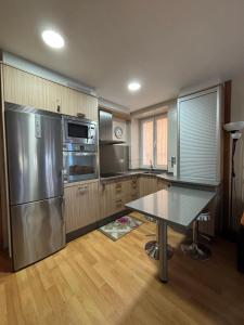 Una cocina o zona de cocina en Apartamento céntrico O Castelo