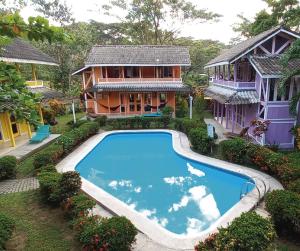 an aerial view of a house with a swimming pool at Villas de la Bahia Playa Tambor in Tambor