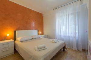 Ένα ή περισσότερα κρεβάτια σε δωμάτιο στο Apartments Nerina