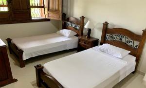 Giường trong phòng chung tại Casa Campestre Vista Hermosa