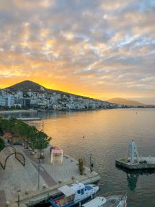 a view of a body of water with a city at Sun N Blue Hotel in Sarandë