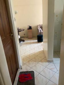 a room with a hallway with a tiled floor at Shikaz Homes Two bedroom in Nairobi +4 photos