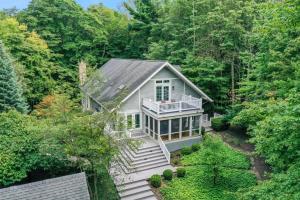 an aerial view of a house in the woods at Naples North in Fennville