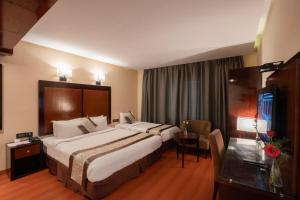 Postel nebo postele na pokoji v ubytování Park Avenue Hotel Nungambakkam