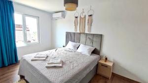 Postel nebo postele na pokoji v ubytování Apartments Halite