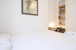 Łóżko lub łóżka w pokoju w obiekcie Valverde Apartment