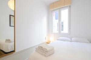 Łóżko lub łóżka w pokoju w obiekcie Valverde Apartment