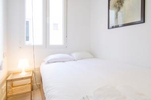 Łóżko lub łóżka w pokoju w obiekcie Valverde Apartment