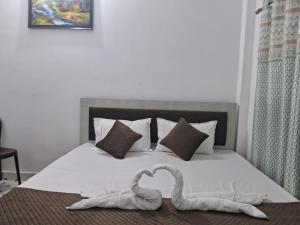 Postel nebo postele na pokoji v ubytování Ramesht Dham Resort