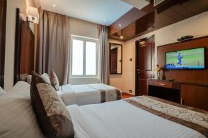 Postel nebo postele na pokoji v ubytování Park Avenue Hotel Nungambakkam