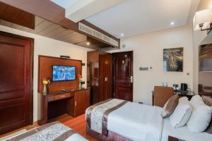 TV a/nebo společenská místnost v ubytování Park Avenue Hotel Nungambakkam