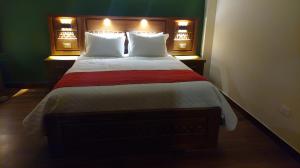 a bedroom with a large bed with two pillows at Hotel Norte Potosí in Torotoro +12 photos