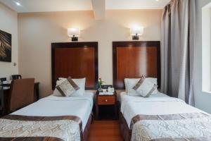 Postel nebo postele na pokoji v ubytování Park Avenue Hotel Nungambakkam
