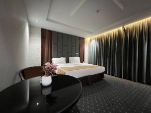 a hotel room with a bed and a table at فندق نجمة روز الفندقيه Rose Star Hotel in Jeddah +80 photos