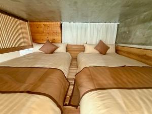 a room with two beds in a room at New Open Japanese style with large bath in Ukaji +24 photos