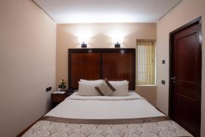 Postel nebo postele na pokoji v ubytování Park Avenue Hotel Nungambakkam