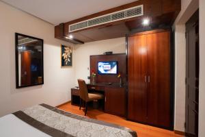 TV a/nebo společenská místnost v ubytování Park Avenue Hotel Nungambakkam
