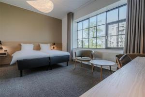 Katil atau katil-katil dalam bilik di Radisson Hotel Papirfabrikken Silkeborg
