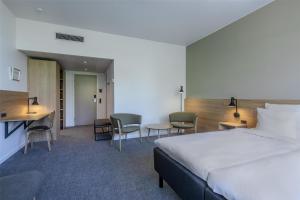Katil atau katil-katil dalam bilik di Radisson Hotel Papirfabrikken Silkeborg