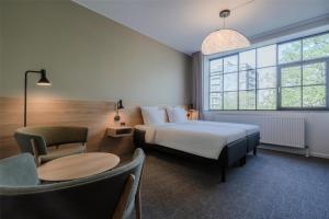 Katil atau katil-katil dalam bilik di Radisson Hotel Papirfabrikken Silkeborg