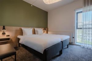 Katil atau katil-katil dalam bilik di Radisson Hotel Papirfabrikken Silkeborg