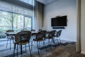 Televisyen dan/atau pusat hiburan di Radisson Hotel Papirfabrikken Silkeborg