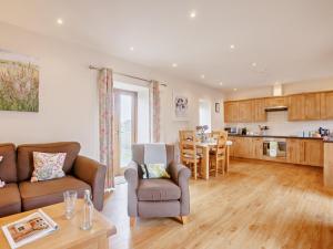 a living room with a couch and a table at 1 Bed in Launceston BRLON in Launceston