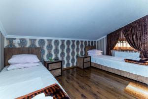 Letto o letti in una camera di HOTEL GUGLUX &WINE CELLAR