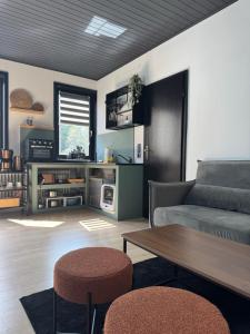 a living room with a couch and a table at Ferienwohnung Grüne Auszeit Braunlage in Braunlage