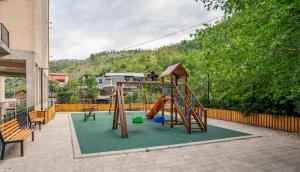 a playground with a slide at Luxury House in Tbilisi City
