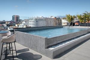 a swimming pool on the roof of a building at AC Hotel by Marriott Tenerife in Santa Cruz de Tenerife