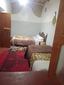 Postel nebo postele na pokoji v ubytování Dar Laayoune
