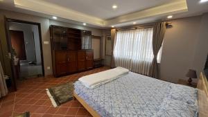Tempat tidur dalam kamar di SiddhiNiwas