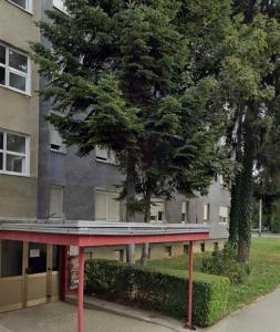 a building with a red table in front of it at Mavrin Home Zagreb, free parking, 3,8km from Old Town, Breakfast in Zagreb