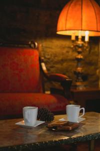 Příslušenství pro přípravu čaje a kávy v ubytování El Serafin Hotel Boutique