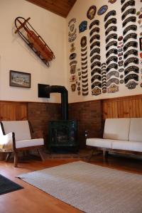 a living room with a fireplace and a stove at Gray Ghost Inn in West Dover