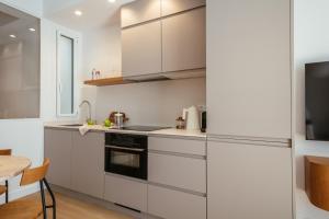 A kitchen or kitchenette at Newly Renovated Stylish Eixample - Great Location