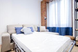 Łóżko lub łóżka w pokoju w obiekcie Minty Stay - Espoz y Mina