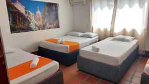 Postel nebo postele na pokoji v ubytování Hotel Toledo FL