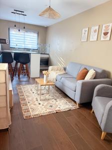a living room with a couch and a table at La maison de villenouvelle in Toulouse