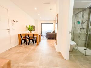 a kitchen and dining room with a table and chairs at El Campello Ocean View Escape in La Venteta
