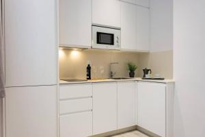 Kuchyň nebo kuchyňský kout v ubytování Minty Stay - Studio La Merced