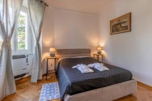 Postel nebo postele na pokoji v ubytování Vista&Capriccio
