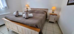 Postel nebo postele na pokoji v ubytování Gîte Paradizu, vue imprenable en Provence