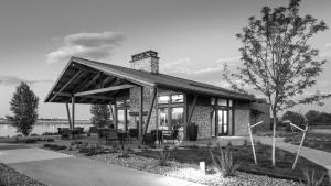 a small brick house with a roof at Cozy Chasm Cottage in Loveland