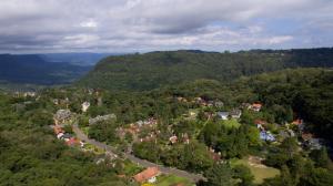 an aerial view of a town in the middle of a forest at Ex Pousada Vale do Bosque - Aluguel por temporada in Gramado