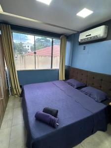 Ένα ή περισσότερα κρεβάτια σε δωμάτιο στο Loft Confortável +6 φωτογραφίες