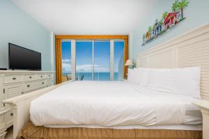 Ένα ή περισσότερα κρεβάτια σε δωμάτιο στο Lighthouse 1417 condo