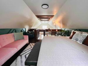 a living room with a bed and a couch at Stilted 2BR canal home, full kitchen, yard, pets! in Crystal River