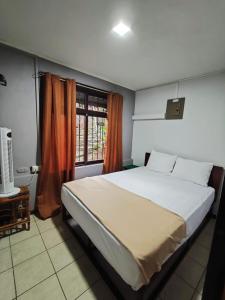 Postel nebo postele na pokoji v ubytování Ávita Lodge